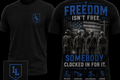 Premium Labor & Legacy Apparel black tee featuring the "Freedom Isn't Free. Somebody Clocked In For It." patriotic trades design. Printed on the ultra-soft Next Level N6210 CVC Crewneck. Available XS-3XL.